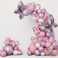 Birthday photo backdrop with butterfly balloon chain