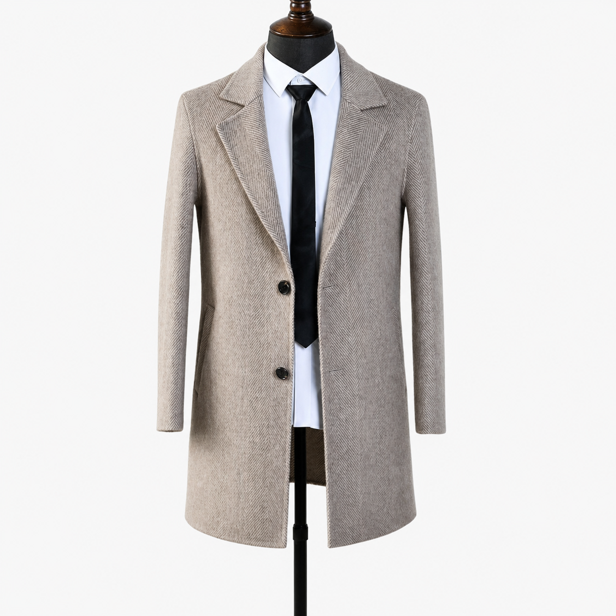 Side profile of the herringbone wool overcoat showing the knee-length skirt and sleeve