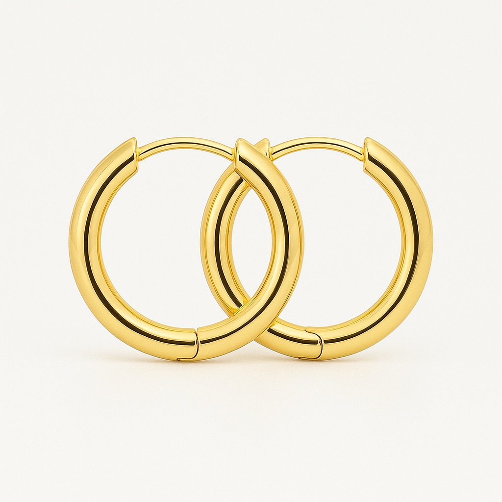 Pair of 18K gold circle earrings resting in an open velvet pouch