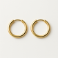 Earring worn through the lobe of a model with light brown hair tucked back