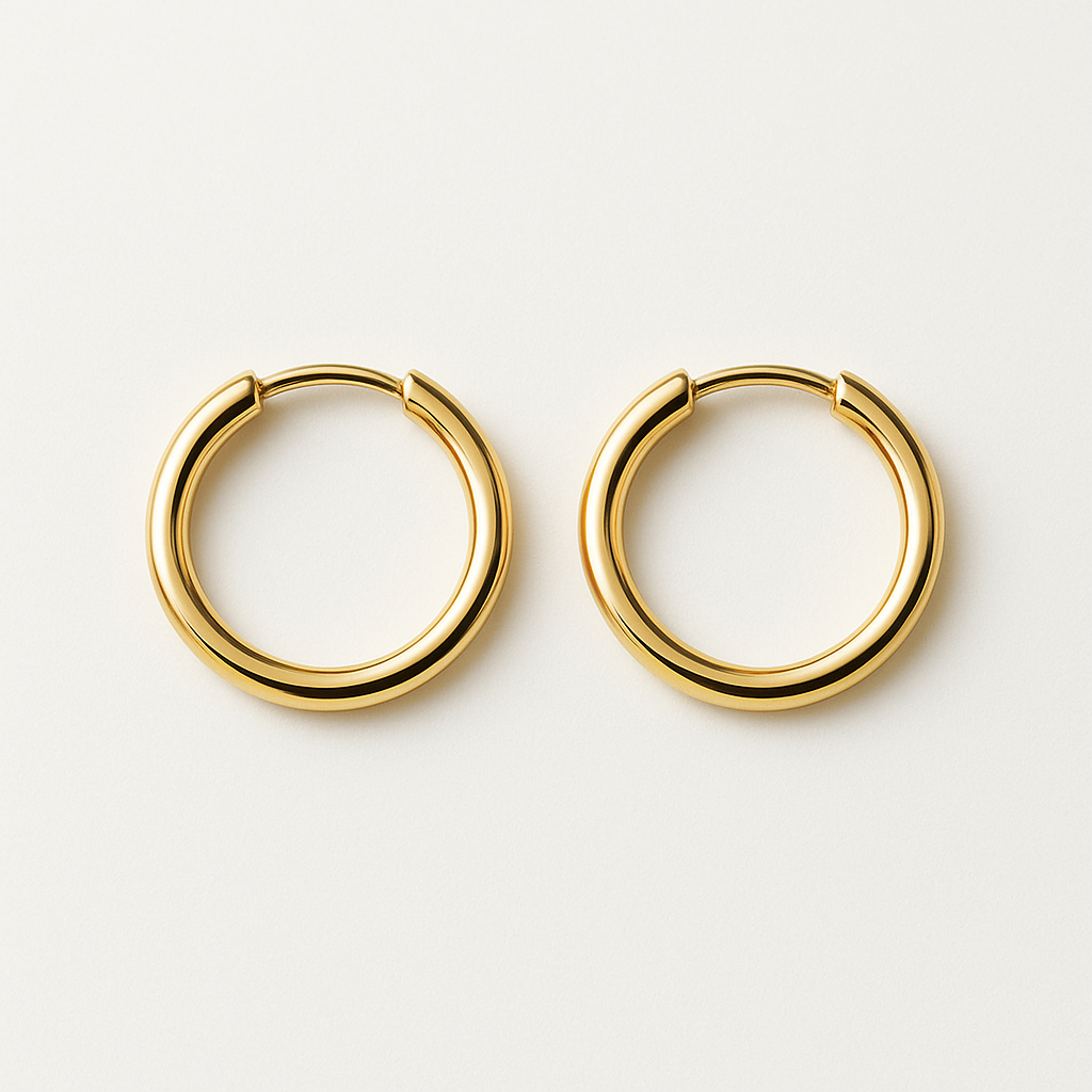 Earring worn through the lobe of a model with light brown hair tucked back