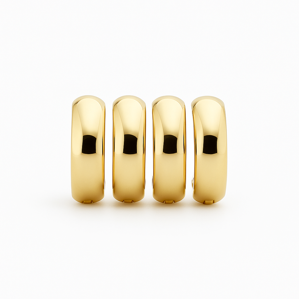 Plain thick 10K gold hoop earrings worn on a soft profile shot
