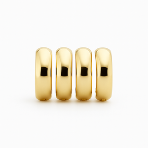 Plain thick 10K gold hoop earrings worn on a soft profile shot