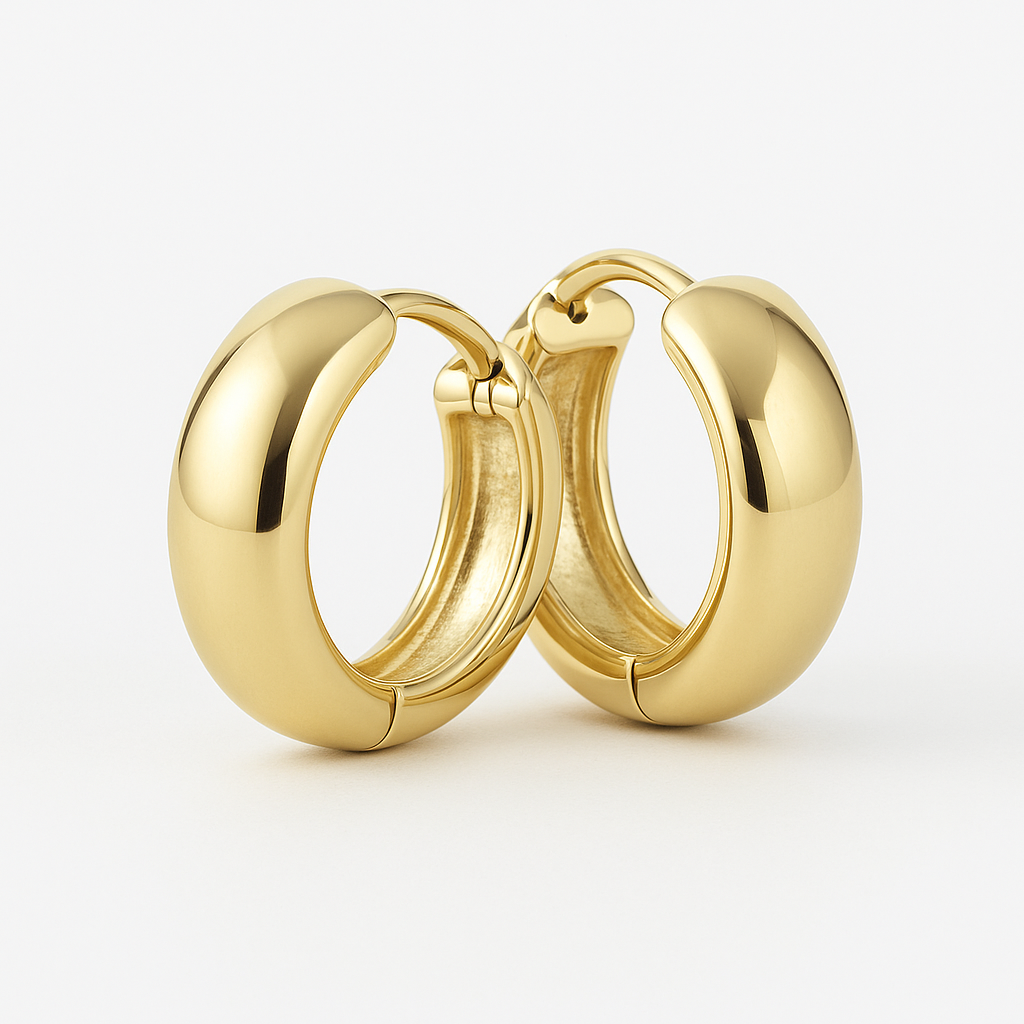 Macro of hinged snap closure detail on the gold hoop