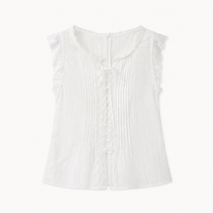 Side view of white flutter sleeve blouse showing gathered sleeve drape and relaxed fit