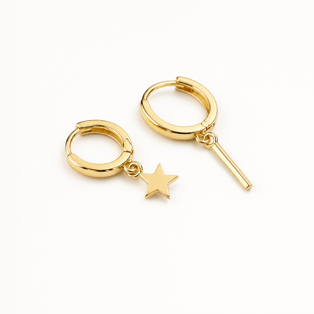 Single earring slid through a lobe with the chain falling toward the jaw