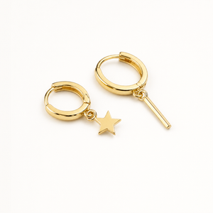 Single earring slid through a lobe with the chain falling toward the jaw