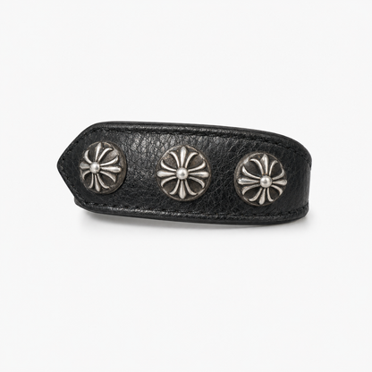 Black leather cuff bracelet with a silver star concho, front view of the strap