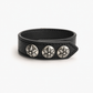 Side profile of the black leather cuff showing the strap thickness and stud