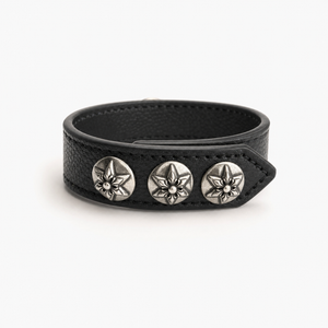 Side profile of the black leather cuff showing the strap thickness and stud