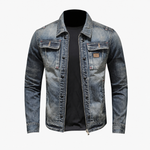 Blue men's trucker jacket worn open over a tee in a casual outfit