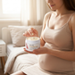 Expecting mother scooping the Melao stretch mark cream