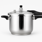 Stainless steel stovetop pressure cooker with locking lid handle on a kitchen counter