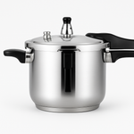 Stainless steel stovetop pressure cooker with locking lid handle on a kitchen counter