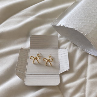 Soline customer photo gold bow stud earrings