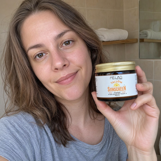 Melao Tallow Sunscreen customer review photo, jar held in hand