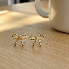 Tobias customer photo gold bow stud earrings