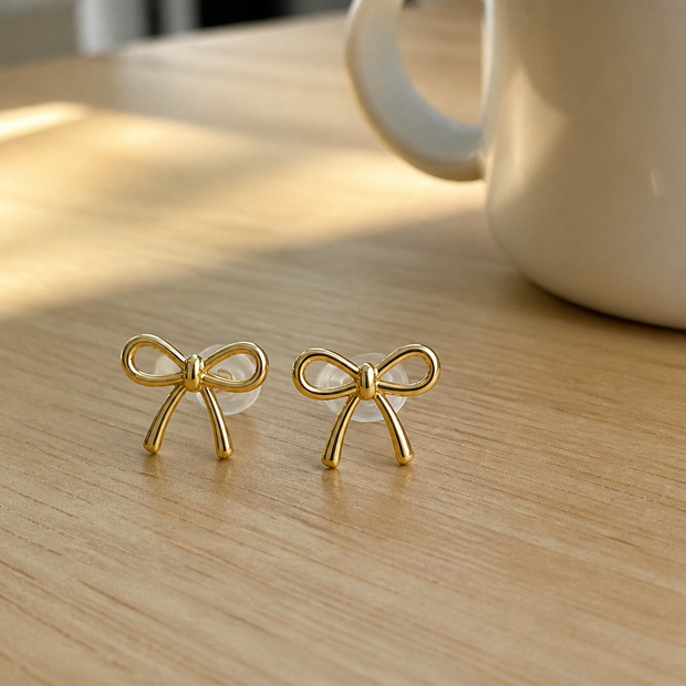 Tobias customer photo gold bow stud earrings