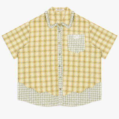 Green plaid short sleeve shirt with doll collar, front view buttoned