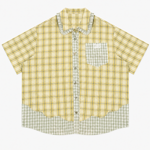 Green plaid short sleeve shirt with doll collar, side profile view