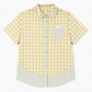 Green plaid short sleeve shirt with doll collar, angled styling view