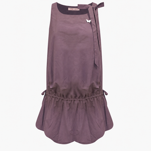 Lace up back camisole dress with embroidered floral hem on model