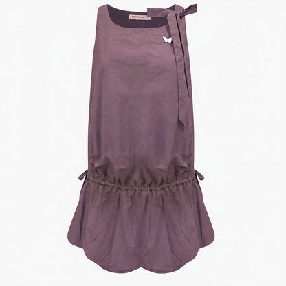 Lace up back camisole dress with embroidered floral hem on model