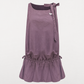 Close up of tonal floral embroidery along the dress hem